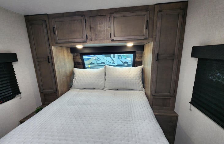 master bed with sky window