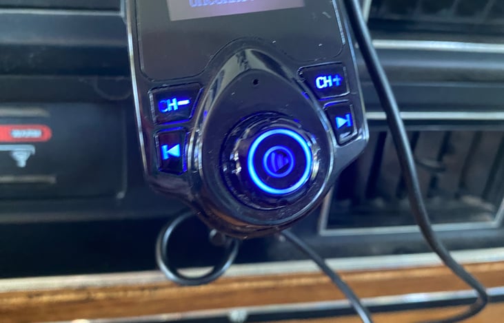 A Bluetooth-enabled charger charges your phone wirelessly and connects to Winne's vintage cassette tape player and radio.