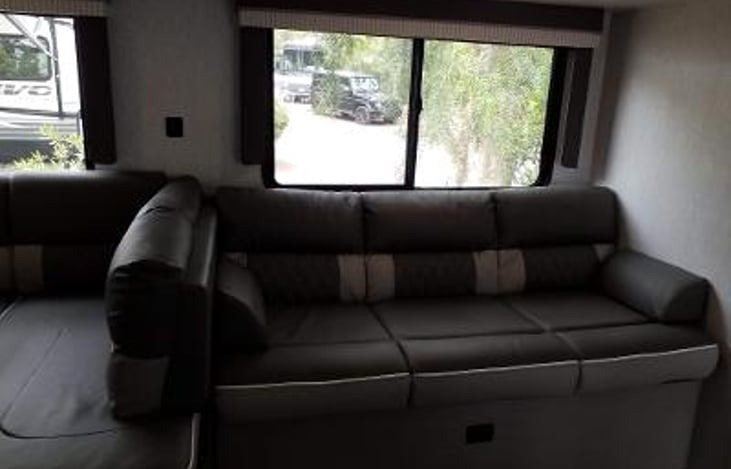 LIVING ROOM SOFA WITH WINDOW VIEW