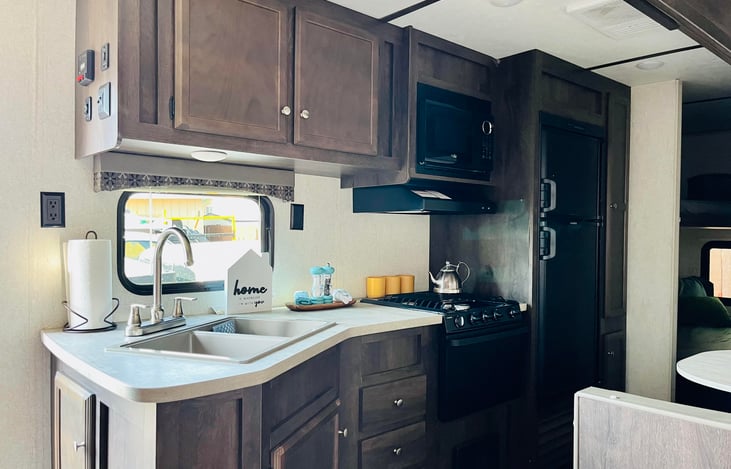 Kitchen, sink and Refrigerator.