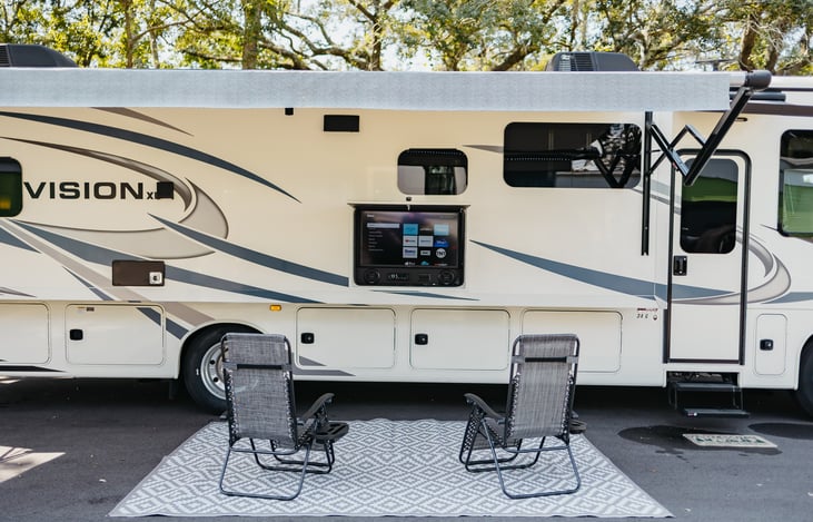 The outdoor awning and provided seating makes for great camping.