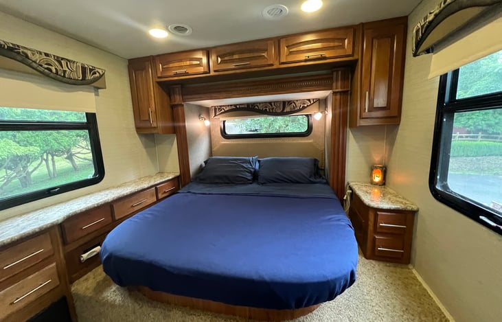 Master bedroom with fold away door for privacy and a tv. Please bring  fire stick as most cable in the campgrounds doesn’t work great