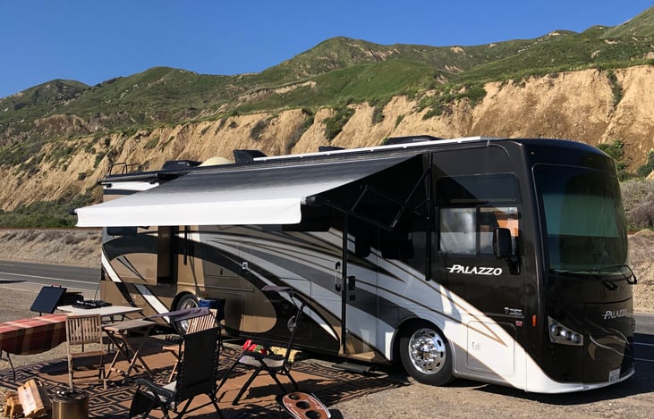 Our beautiful home on wheels, comes with camping chairs, gravity chairs,  banquet table, awning, pop up canopy tent and corn hole game.