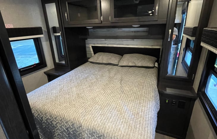 Separate master bedroom with queen mattress & door for privacy!