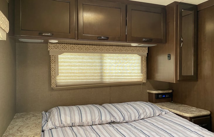 Master bedroom with bed and audio system