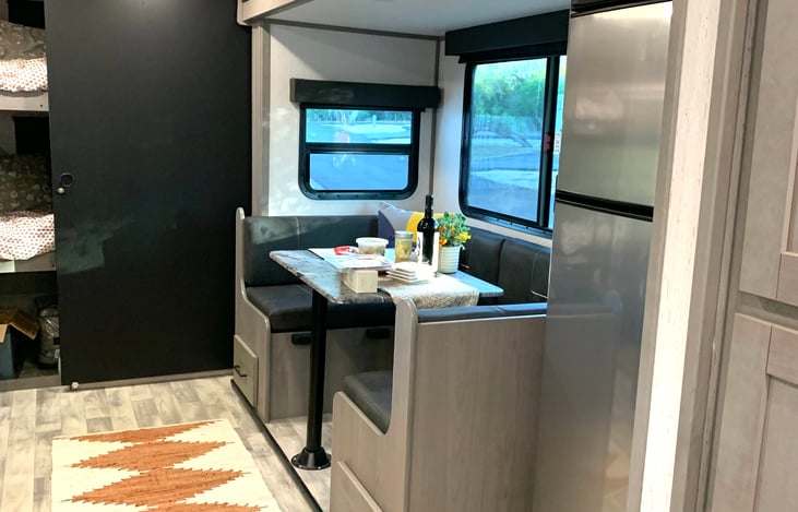 The Dinette across from the TV and Fireplace, can be converted for 4 only or up to 6. Then Converted into another Full size Bed. the Fridge/Freezer shown is full size.