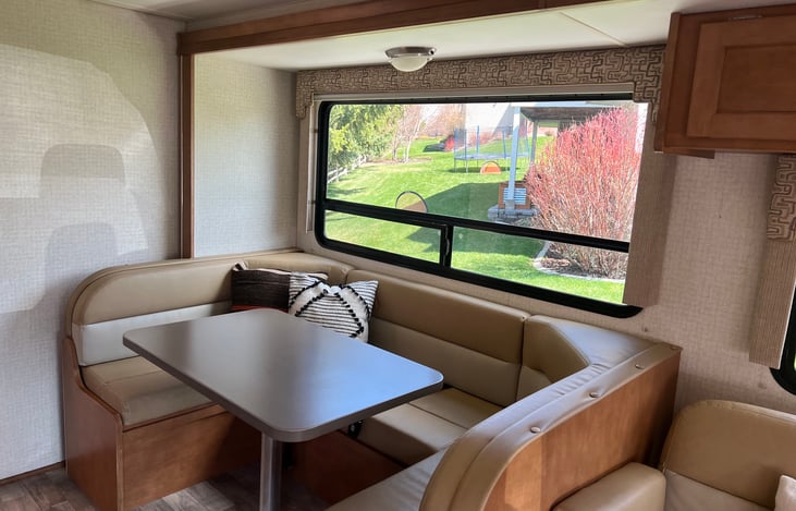 Large u-shaped dining area, table folds down to sleep two people.