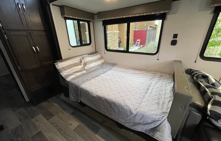 Convert dining table to sleep two guests.