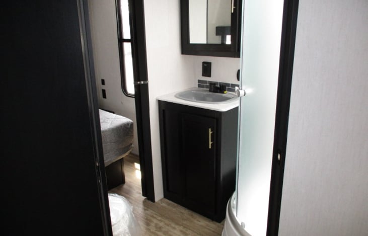 bathroom with entrance from main area and bedroom