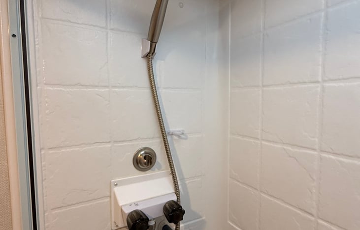 Upgraded shower head for increased water pressure.