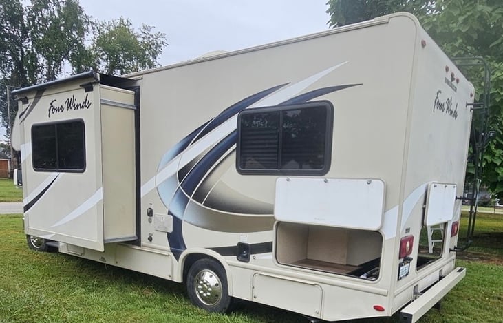 Back side and driver side view with slide out and more storage compartments.