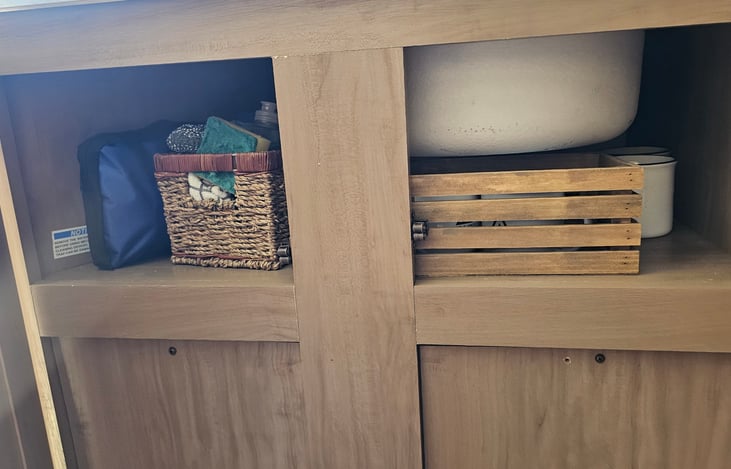 Under Sink Storage. FIrst Aid Kit, Dish washing supplies, and coffee provided for the first two days.