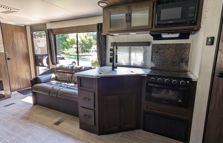 There is plenty of kitchen storage along with a microwave.