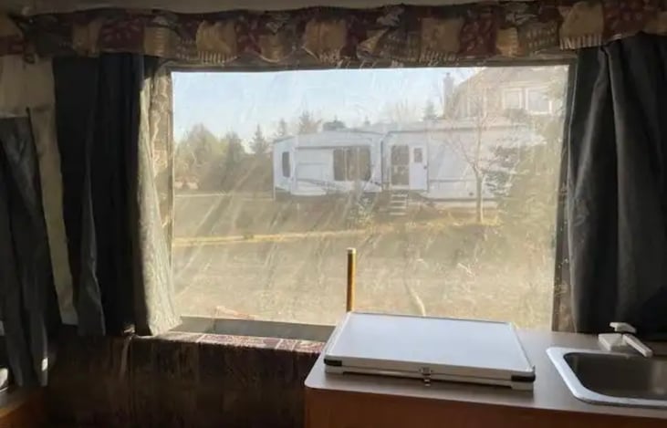 Immaculate interior, fold over gallery which includes sink and 2 burner propane stove.