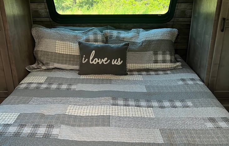 Bedroom - RV Queen Bed; lots of under-bed storage, two closets and nightstand cubbies.