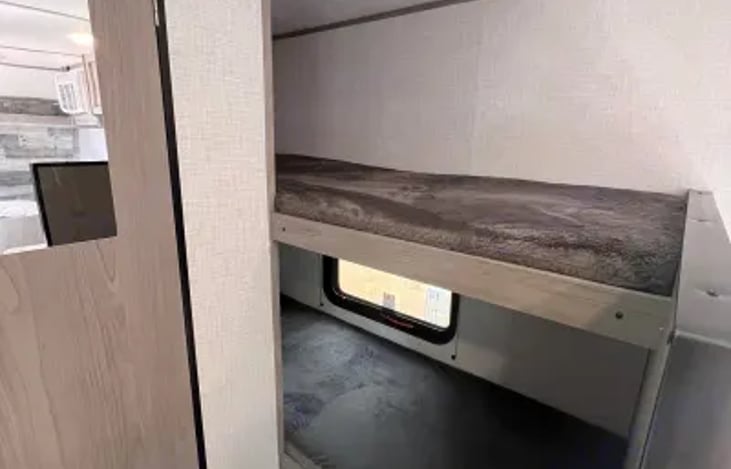 Twin bunk beds. Perfect for the kids but can comfortably fit any adult, or room for extra storage. And there's even more storage underneath.