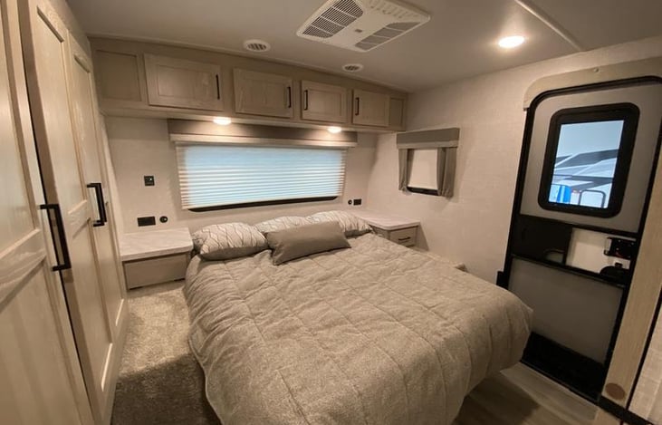 Master Bedroom Queen Bed with usb plug ins on each side and soft reading lights above. Private entry Door