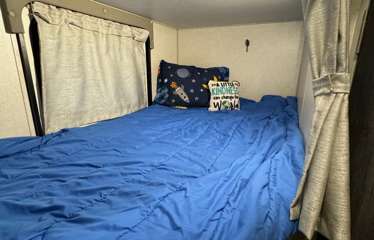 Lower bunk has touch light, usb for charging,  dual fans and an access door to outside