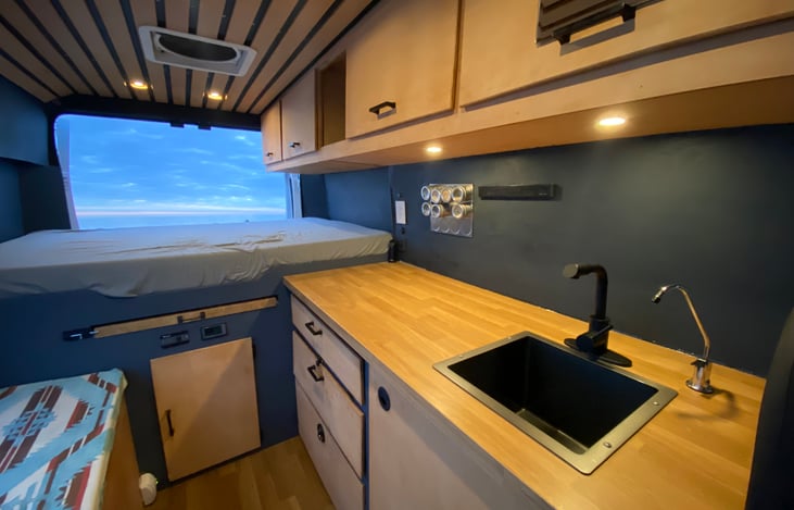 Bed, Kitchen, and Upper Storage