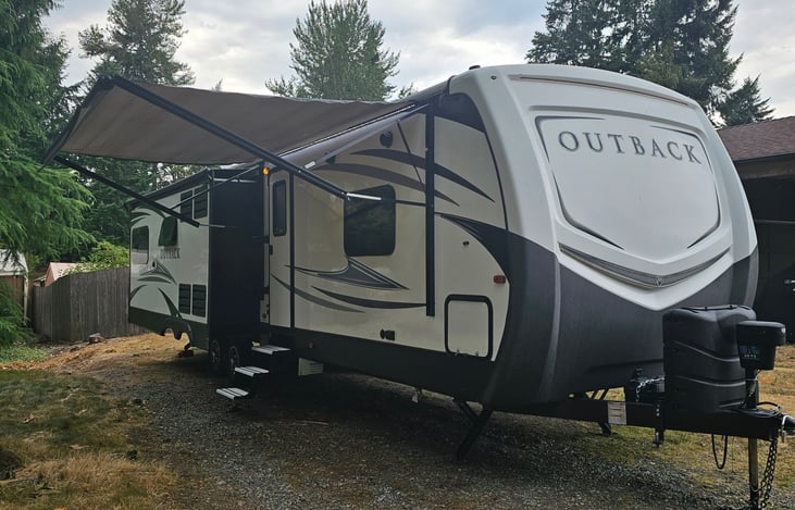 Awning over entertainment area with LED lighting makes for a comfortable area to entertain.