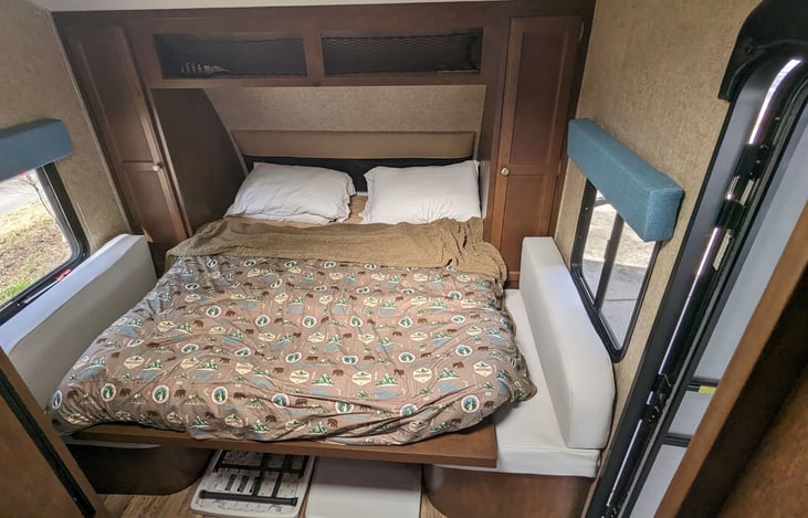 Space-saving queen murphy bed folds down over the dinette when needed... and up out of the way during the day. Upgraded memory foam mattress ensures a good night sleep! (Linens available upon request)