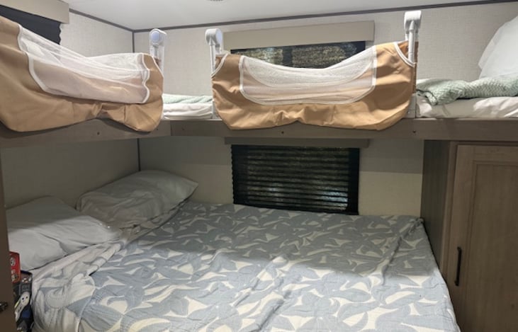 Double bed on the lower bunk with memory foam mattress topper. Upper bunk has side rails to keep children from rolling out.