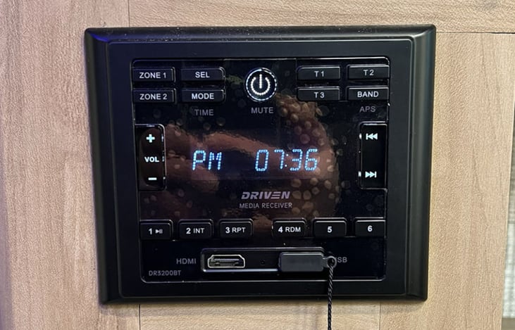 Integrated sound system with bluetooth connectivity to your phone. Controls indoor and outdoor speakers.