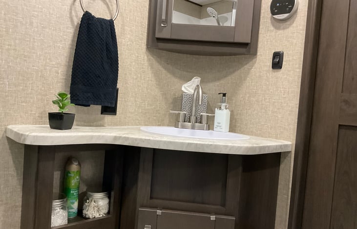 Upper and lower cabinets in the bathroom provide plenty of room for your toiletries.