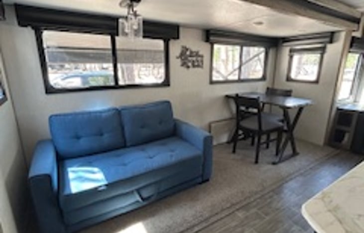 Blue couch folds down for more sleep space!!