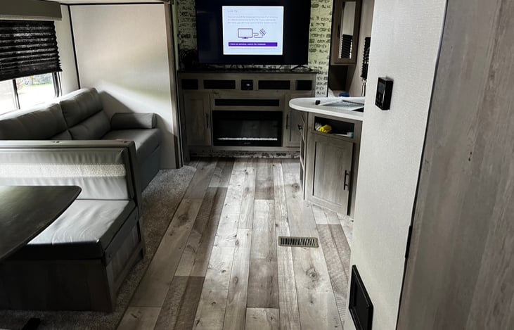 Living area with a large smart TV.