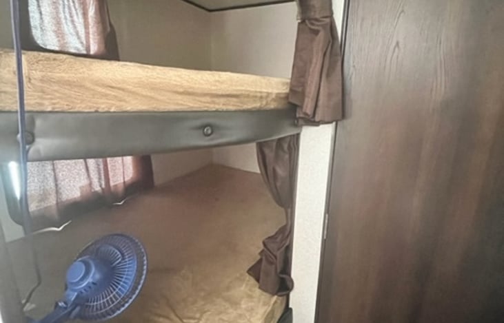 Bunk beds, curtains for privacy, windows and shades in each bed. Provided fans available