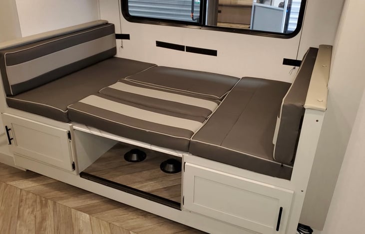 Kitchen table turns into queen bed.