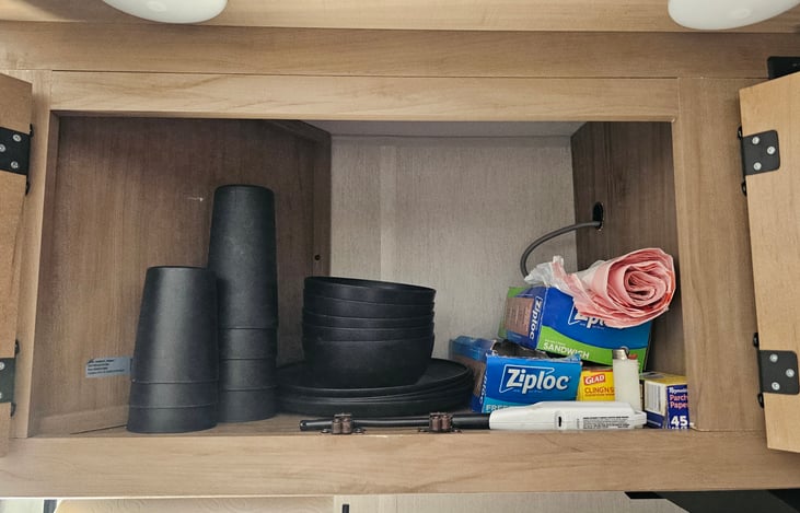 Comes with Dishes for 5 as well as extras including Ziploc bags, trash bags, and lighters