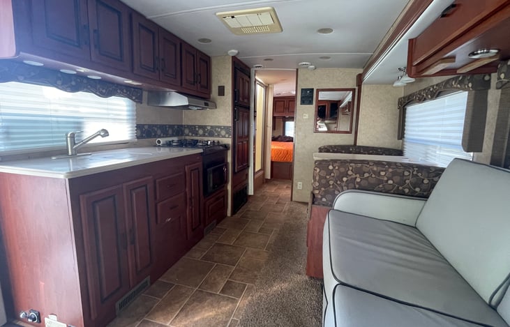 big kitchen area. double sink. central air and heat. sofa has two seatbelts and converts to a full size sleeper.