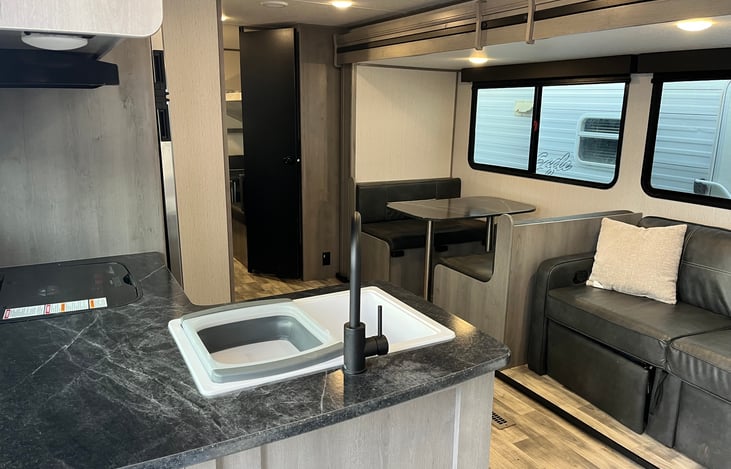 Table and couch convert into beds.