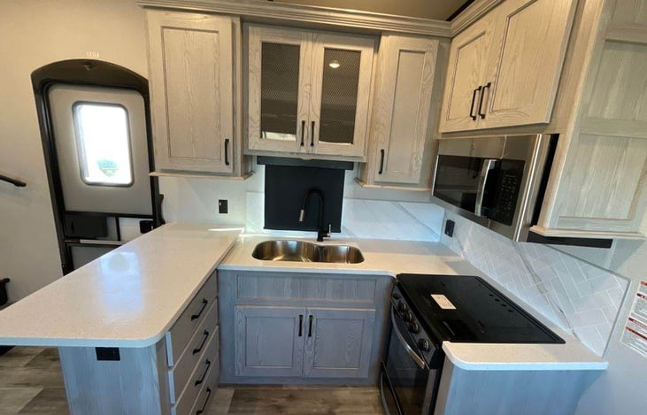 Open kitchen area with lots of storage areas.