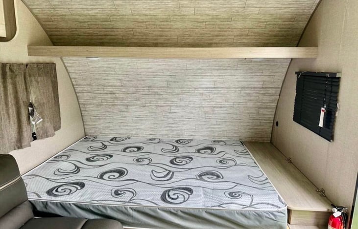 Queen size bed. We provide an upgraded mattress and all of your bedding and pillows. There is storage and a USB port at the end of the bed.