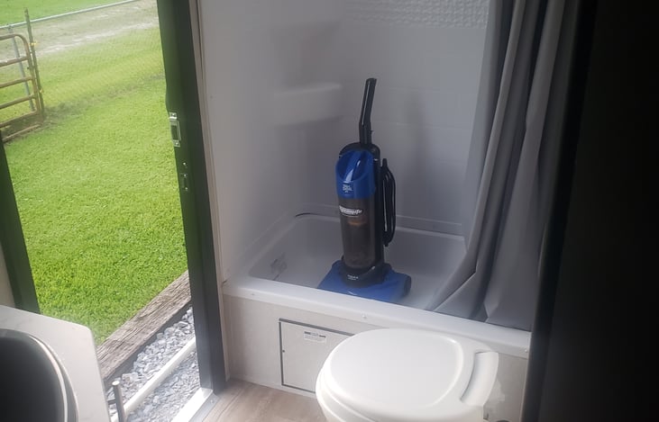 Spacious bathroom with full shower and bath entry door from outside as well as inside.