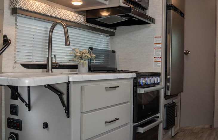 full kitchen fully stocked and fold down extra counter space