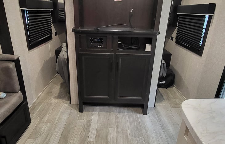 Entertainment Center with bedroom doors open