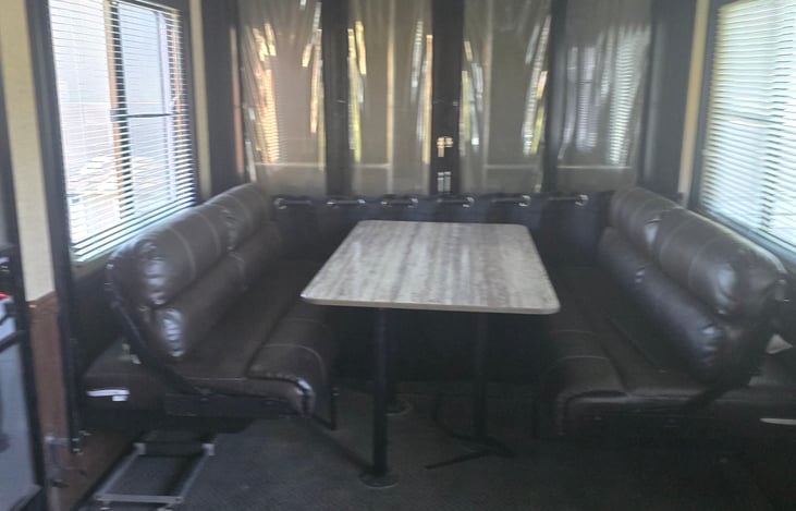 Rear space with dining for 6 or double bunk beds that sleep 4 off rear patio.  Seperate enterence, privacy curtains and seperate bathroom.