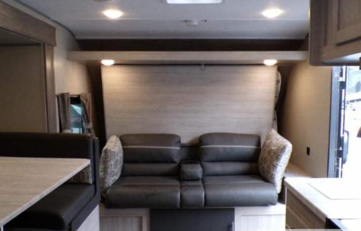 Comfortable seating. The couch lays flat and Murphy bed drops down.