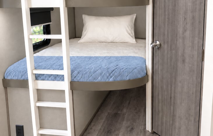 Cozy double bunks with coastal touches—a little space to unwind after a day of adventure. 💙