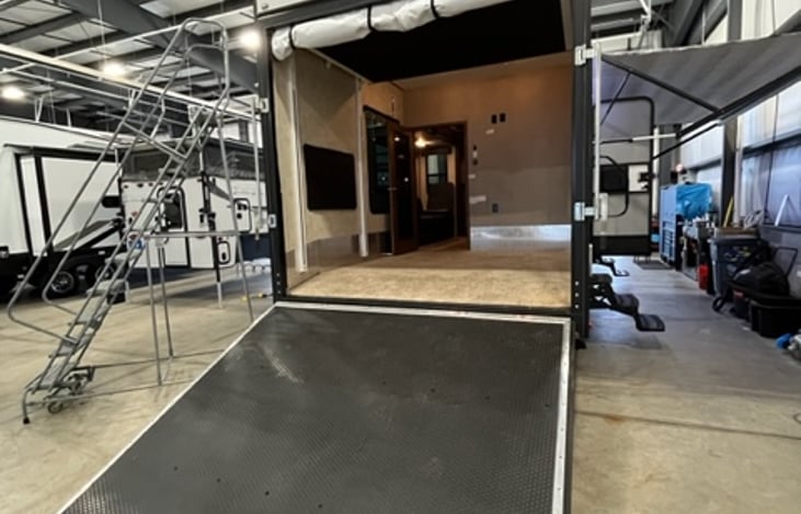 Rear Ramp door for wheelchair or handicap access. There is also a vinyl drop down divider for temporary closure.