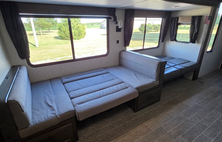 Table folds flat as well as the couch for sleeping space.