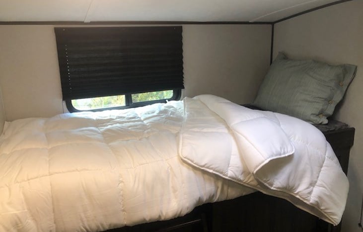 One of two upper bunks