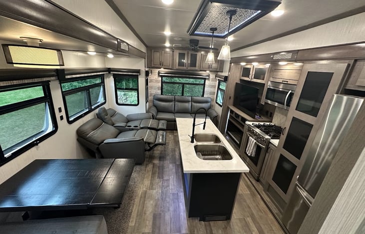 This is what you see when you first walk into the RV, The Kitchen and Living Room Space viewed from the front door.