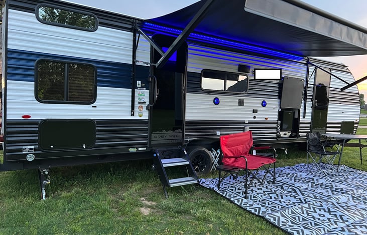 Outside view with sitting area and outdoor kitchen
