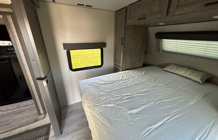 Queen sized Mattress - Cubbies with Charging outlets on both sides behind cabinets (storage for phones, wallets,drinks, etc. while sleeping)

Storage compartment under mattress