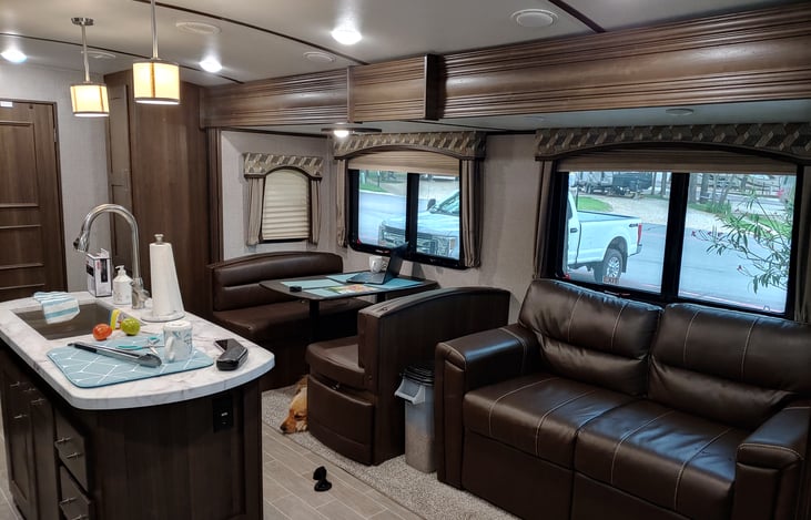 Dining table folds flat for sleeping area.  Love seat folds out as a sleeper sofa.